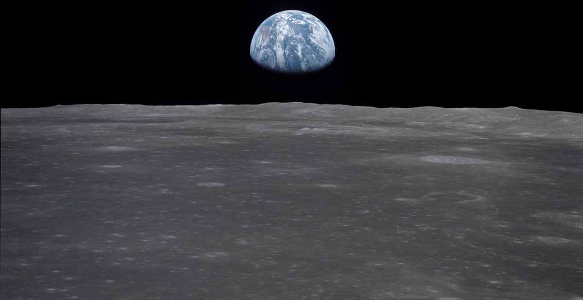 Apollo 11 Mission image - View of moon limb,with Earth on the horizon,Mare Smythii Region